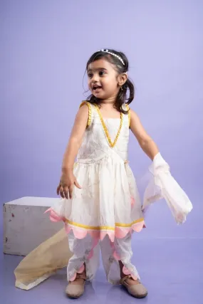 Charming white dhoti-style set with floral embroidery and playful yellow and pink accents, perfect for festive occasions
